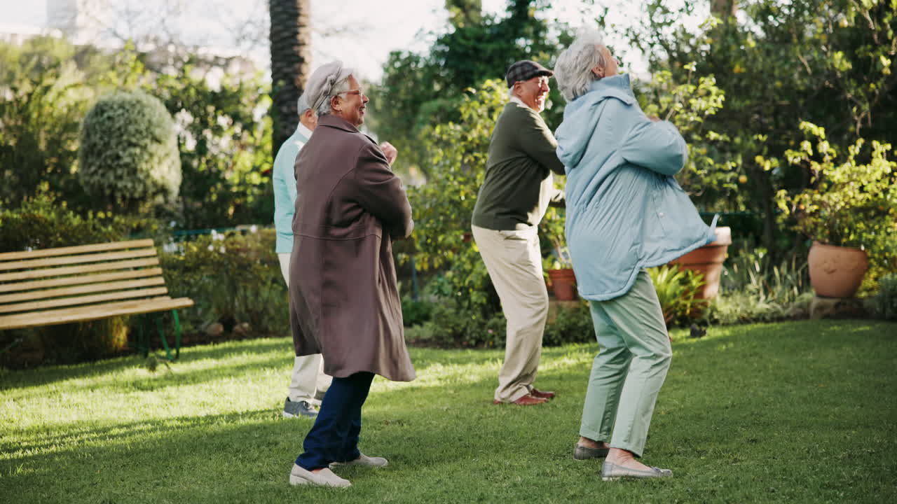 Seniors dancing in a garden
