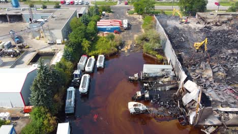 remains of a chemical plant after a fire with a large chemical spill