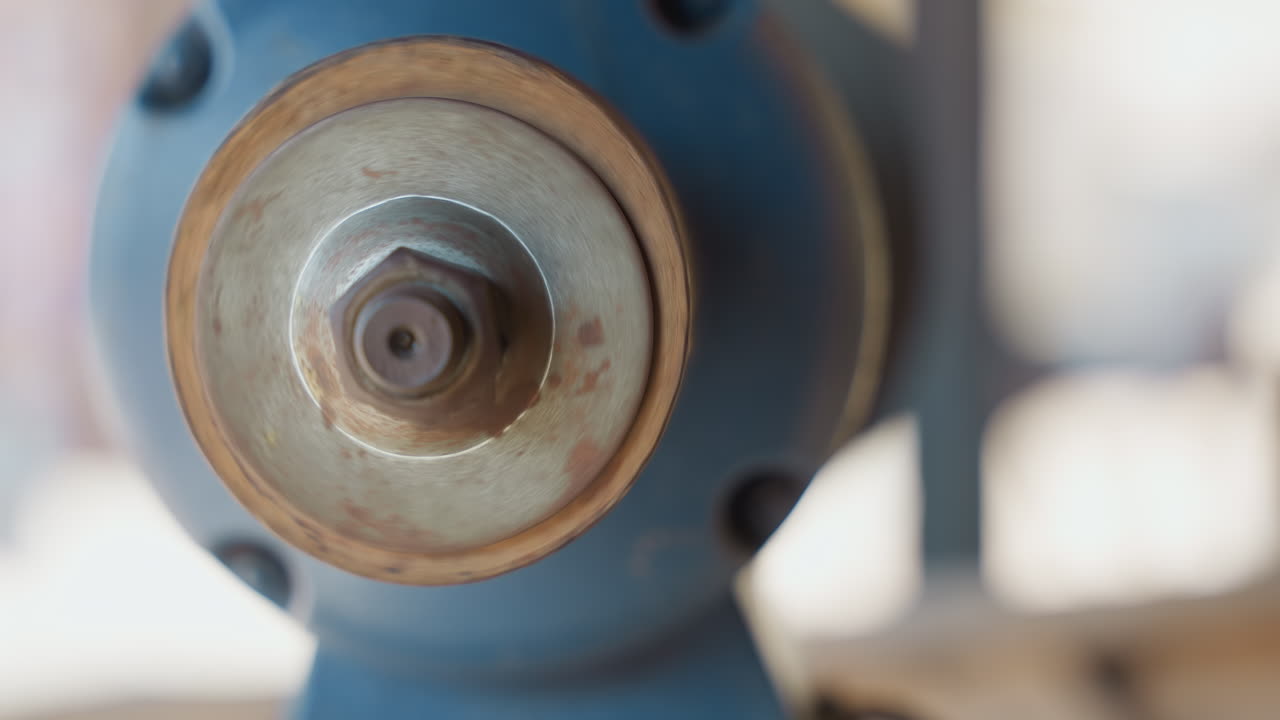 Tight close up grinding wheel center rust, focused shop atmosphere with neutral background, metal collar showing corrosion and grit, repair and restoration for carpentry tools, tactile texture