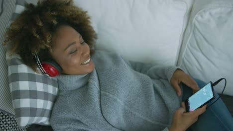 Content-woman-enjoying-music