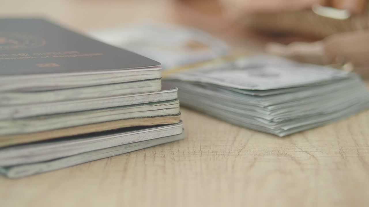 Stack of Passports on a Table