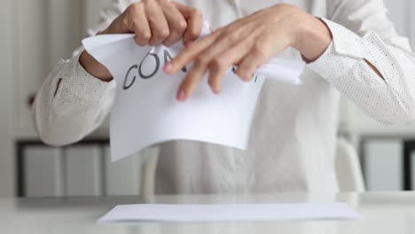 business woman tearing contract at office closeup