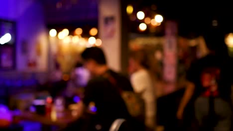 people socializing in a vibrant, colorful setting