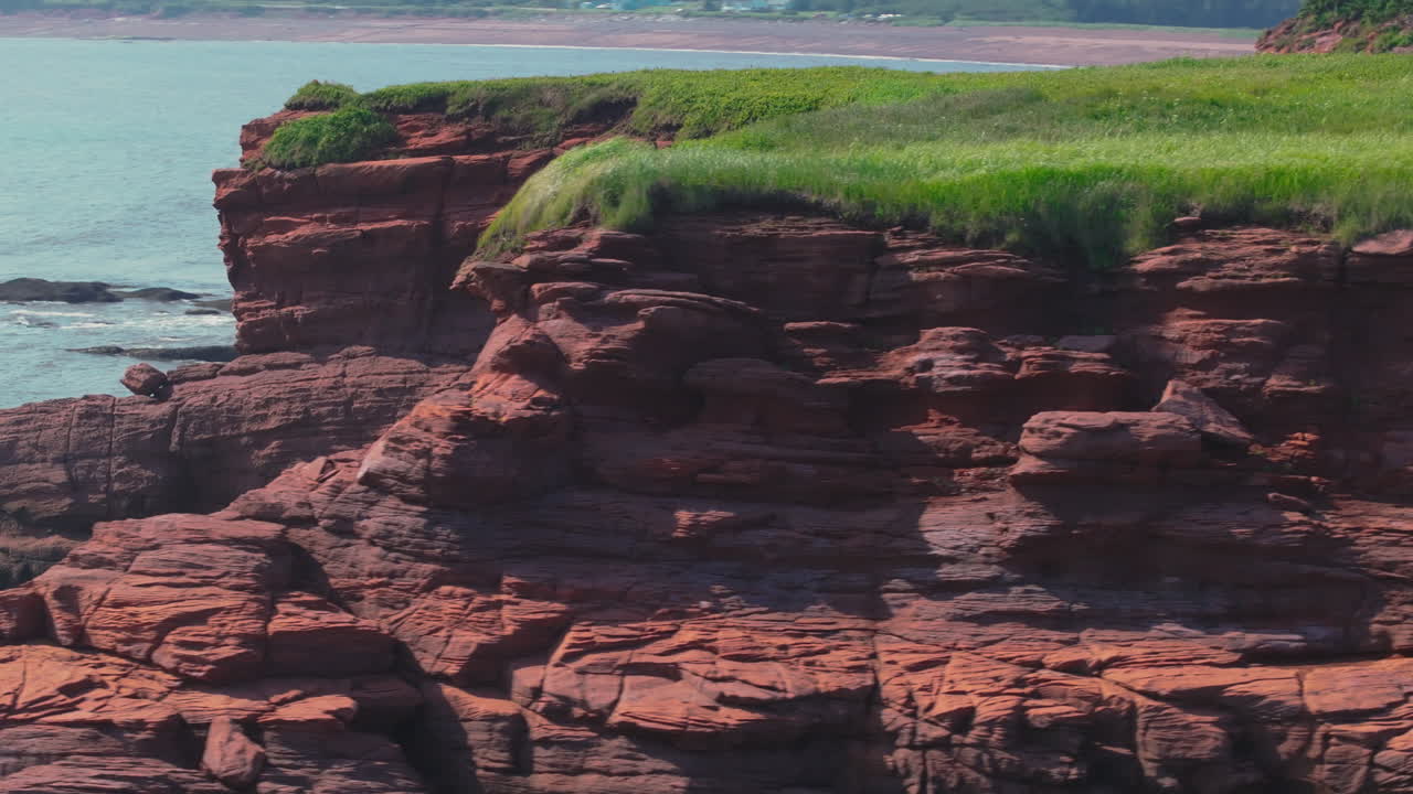 Sweeping around the windy cliffside at Duckpond Beach, Bay of Fundy in Eastern Canada