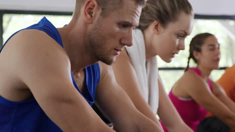 Working-out-on-exercise-bikes-at-a-gym