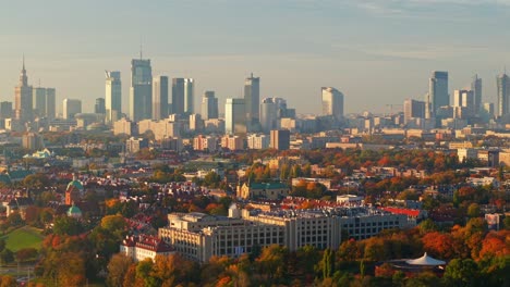 aerial view of sunny misty october morning above warsaw poland old town and downtown cityscape skyline, drone shot