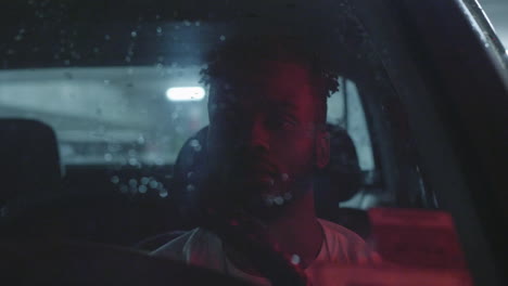 african american man waiting in car during traffic jam