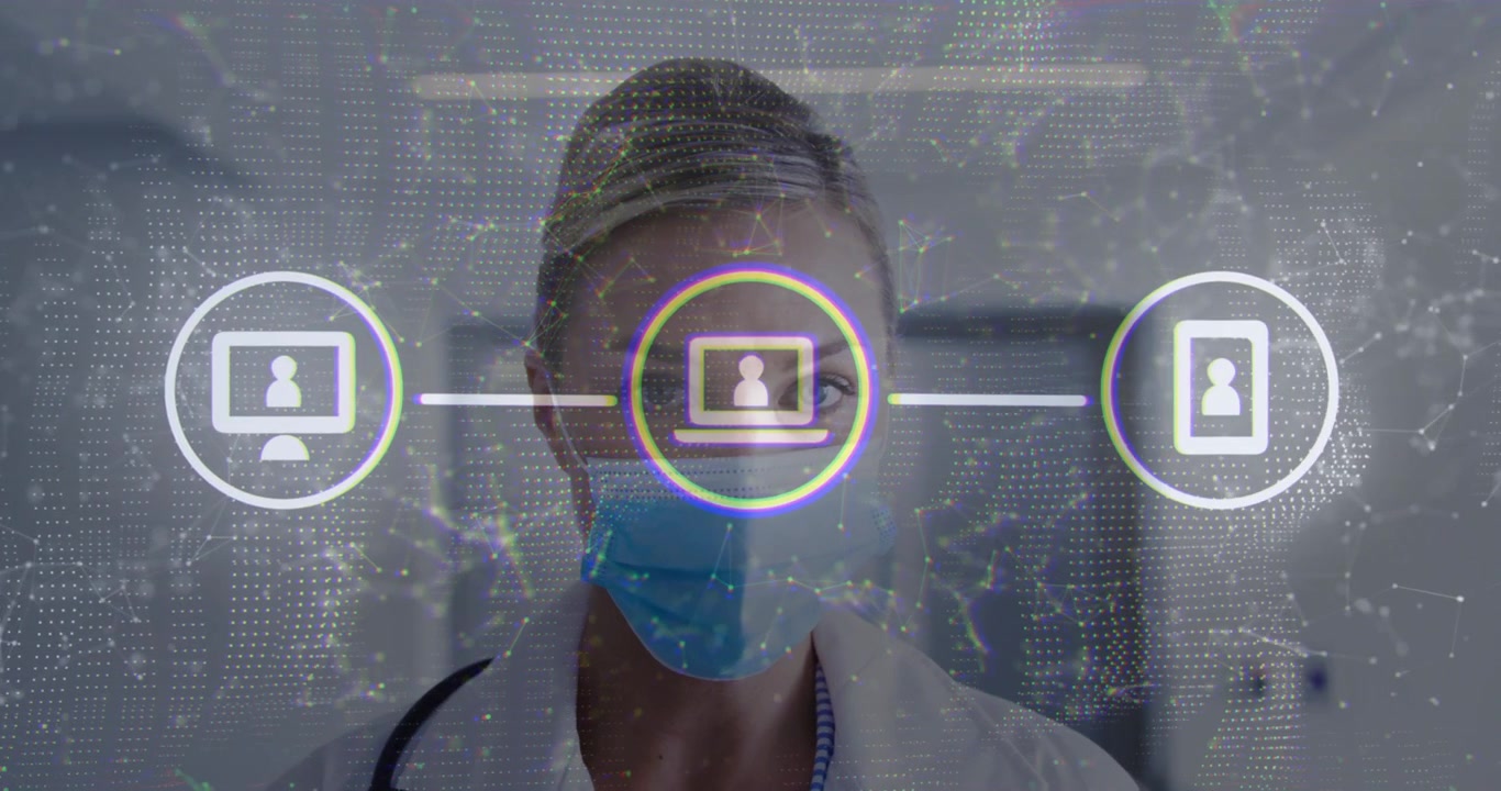 Clinician viewing incoming vitals to track patient status mesh overlay linking monitor laptop phone