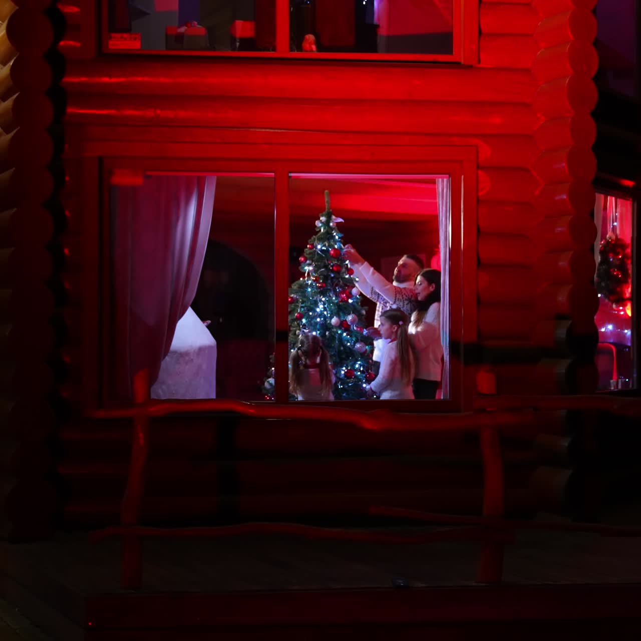 Family decorating christmas tree. Happy family preparing for New Year winter holidays