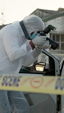 crime scene investigation - a forensic photographer at work