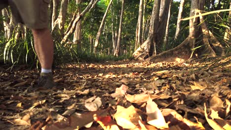 man walking towards camera ground shot