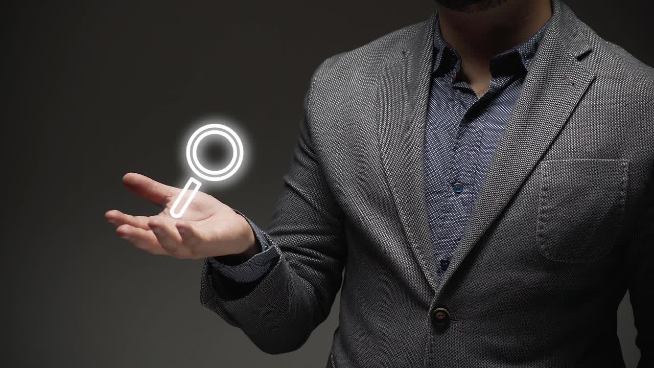search concept. a business person shows magnifying glass .