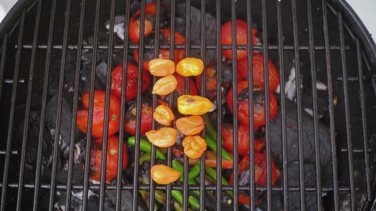 Hot Spicy Serrano Chilli and Habanero Chilli on Grill at a Meixcan BBQ