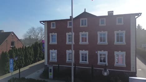 polish flag on flag pole building wave on wind boom crane