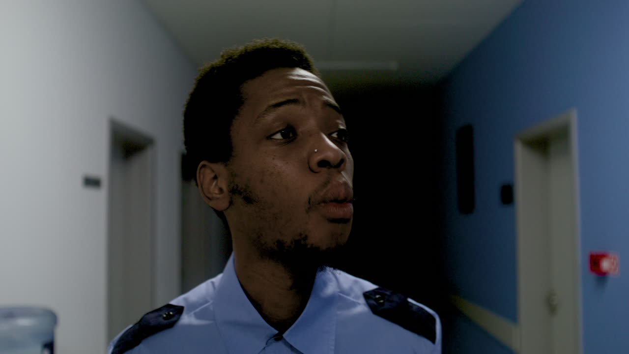 Man in uniform relaxing on the corridor