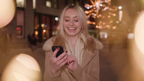 attractive lady shops online with her phone to find the perfect gift