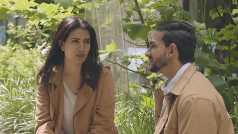 Muslim-Couple-On-Date-Sitting-And-Talking-Together-On-City-Street-2