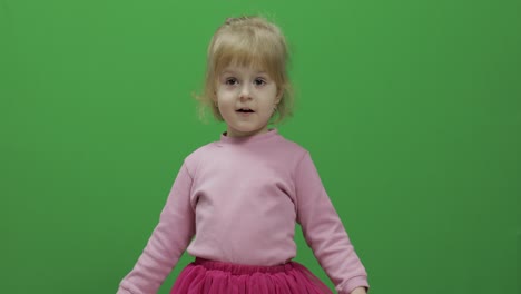 Happy-three-years-old-girl.-Cute-blonde-child.-Dancing-and-make-faces