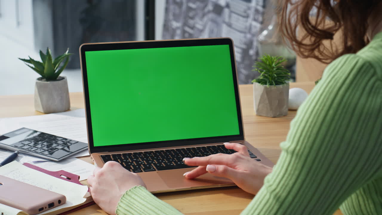 Woman using touchpad chromakey laptop at office closeup. Businesswoman online