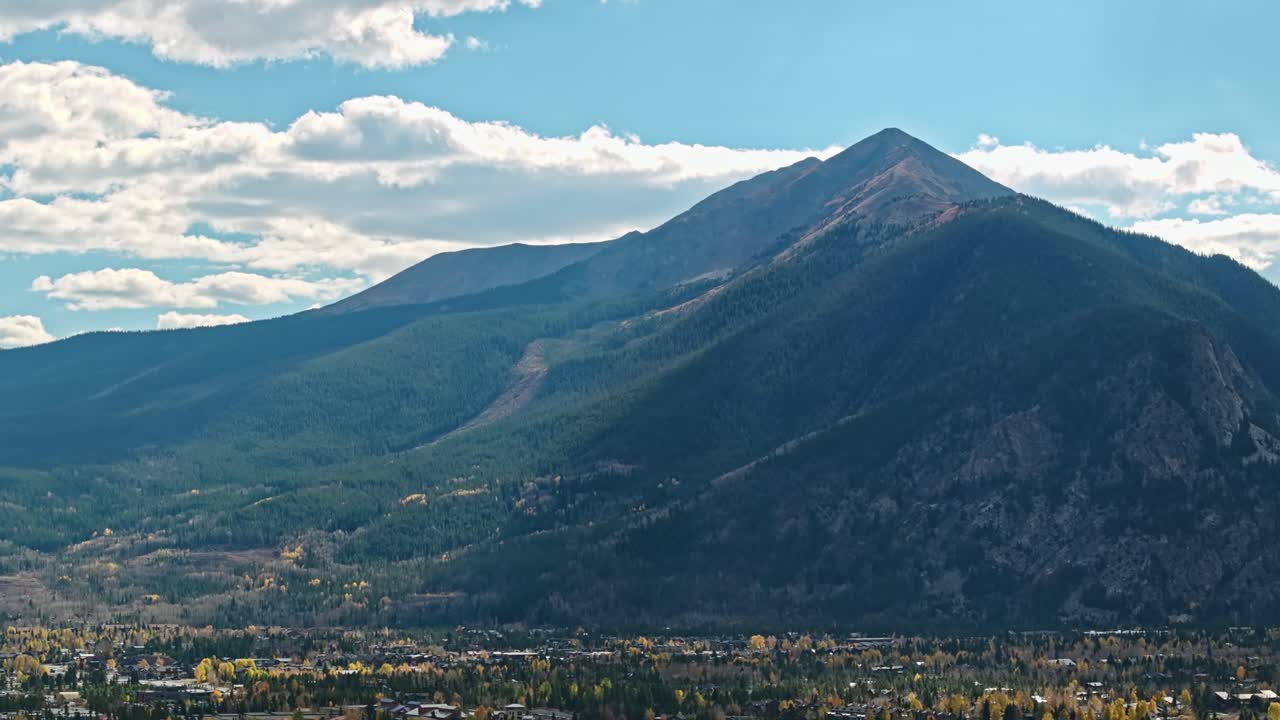 Stunning Mountain Landscape with Autumn Foliage and a Town Below