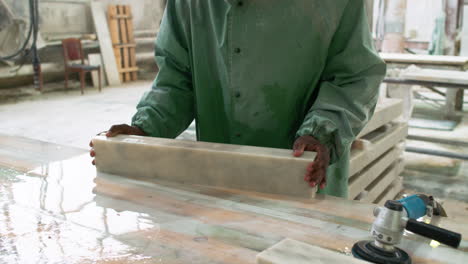 man polishing marble