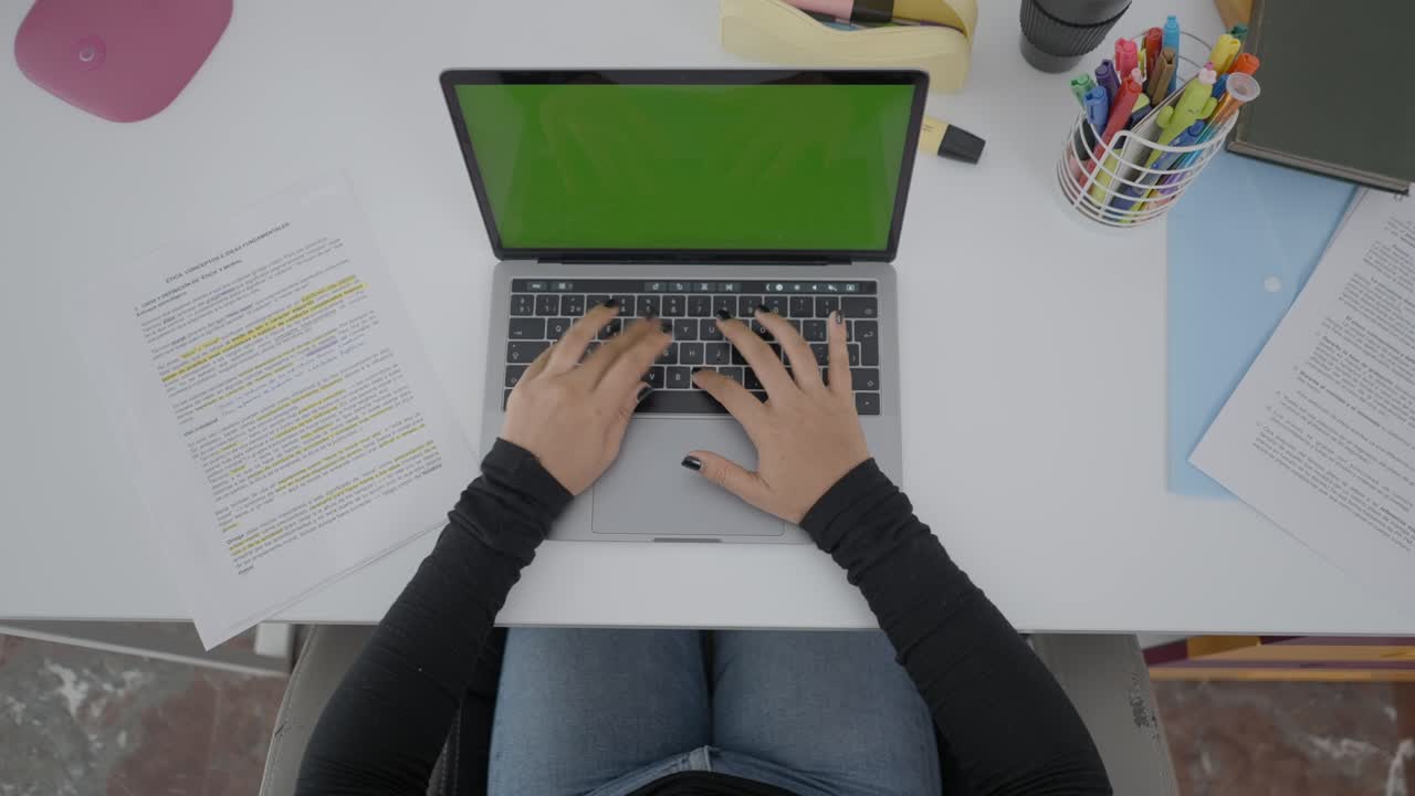 Person Working on Laptop at a Desk