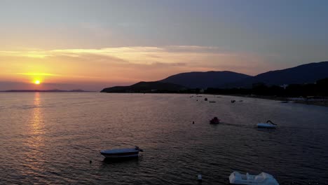 Aerial-forward-flight-of-captivating-dark-coastal-view-at-sunset,-Turkey