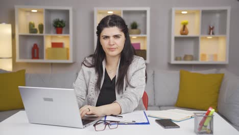 Home-office-worker-woman-says-shhh-to-camera.