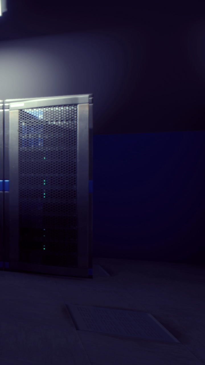 Server room with digital equipment surrounded by dark walls and lighting