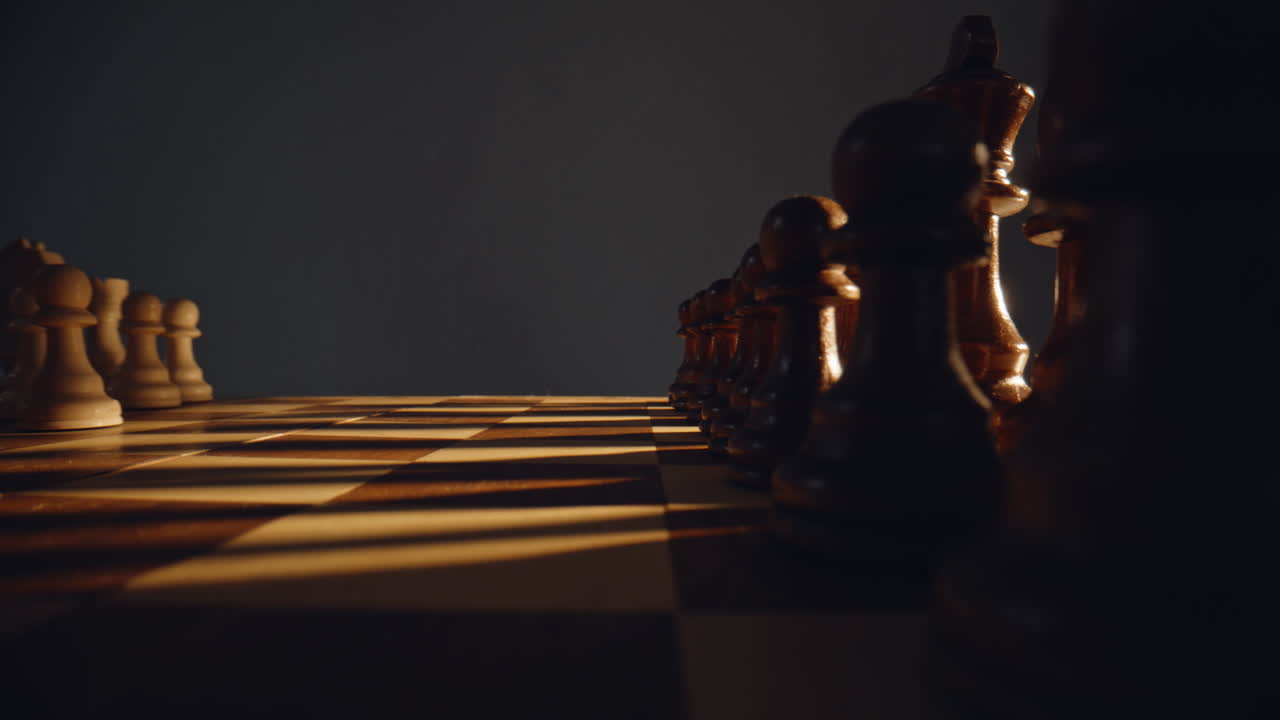 Player hand placing figure wooden board indoors closeup. Strategist pushing pawn