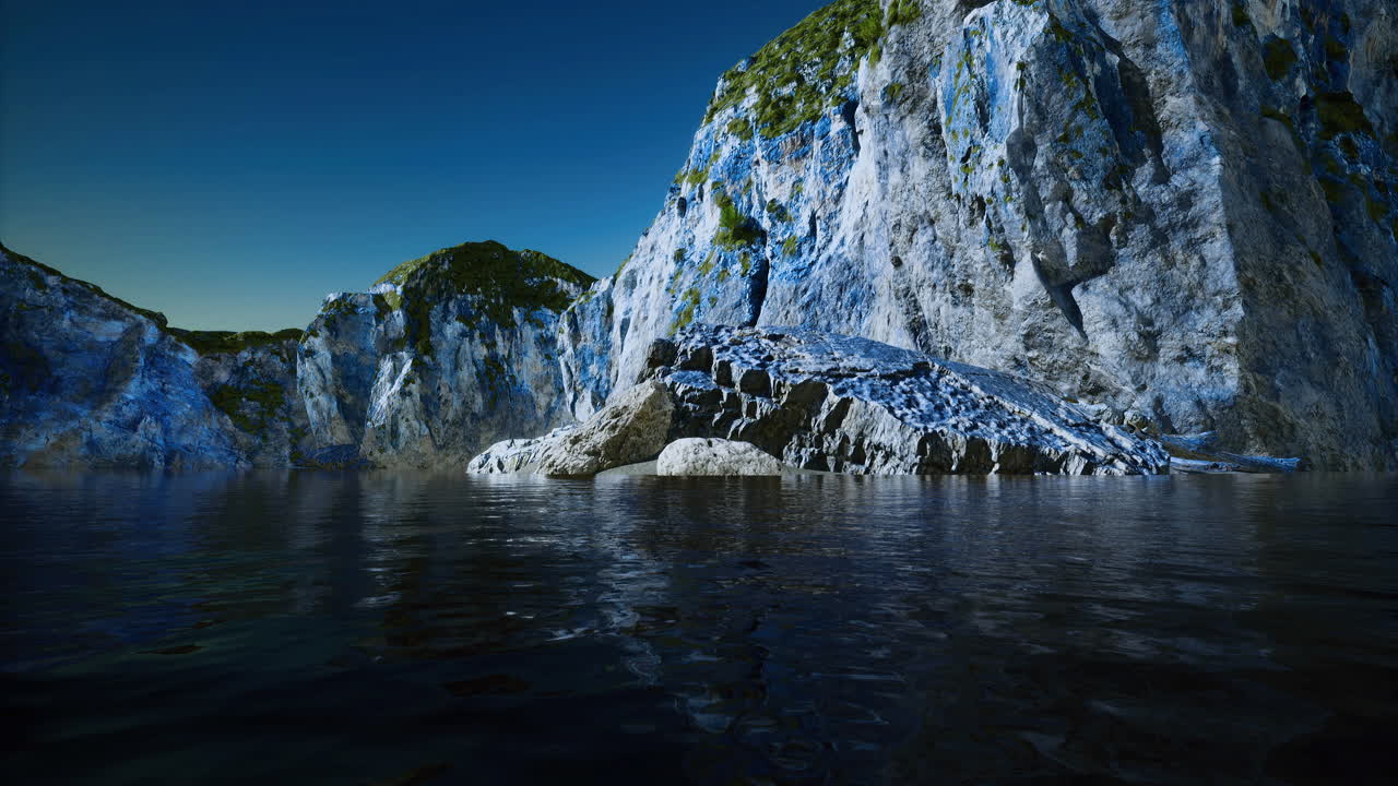 Beautiful rocky shoreline with calm waters and clear sky during daytime