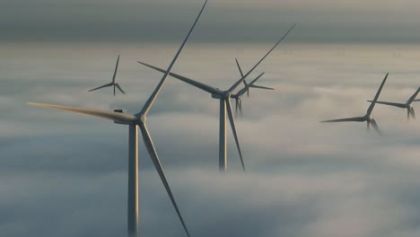 unreal drone view - wind turbines rotating above clouds