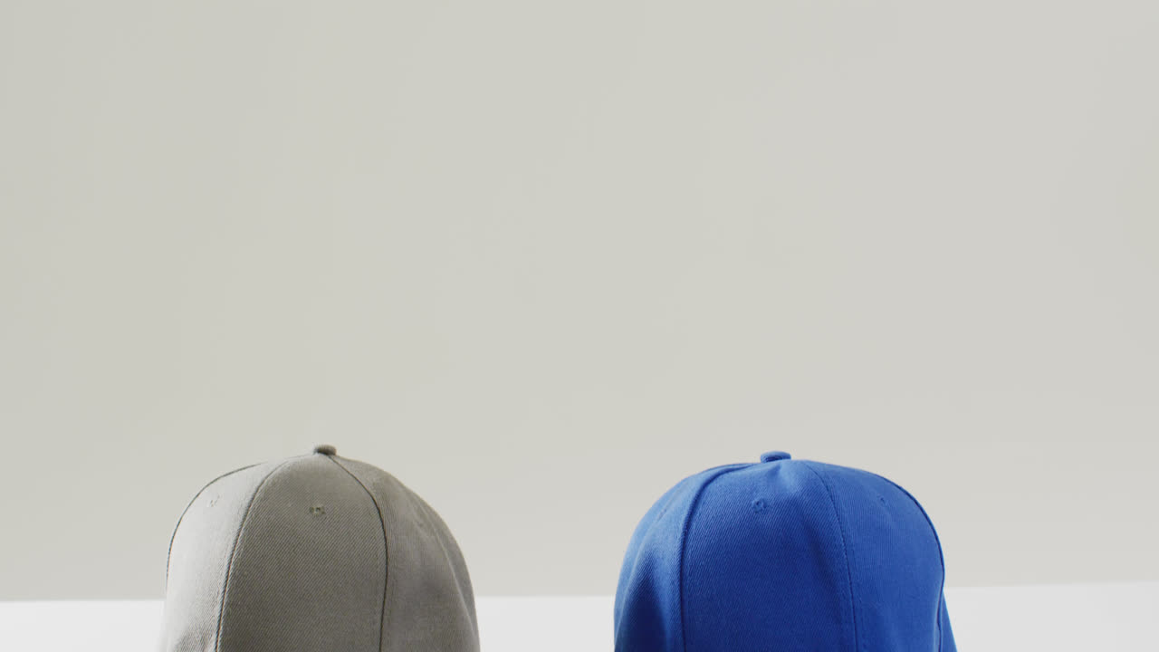 Video of close up of caps on white background