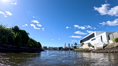 boat journey through gold coast canal, sunny day