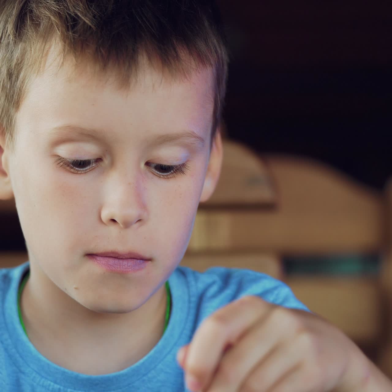 Boy is eating ice cream in a cafe. Kid with sundae