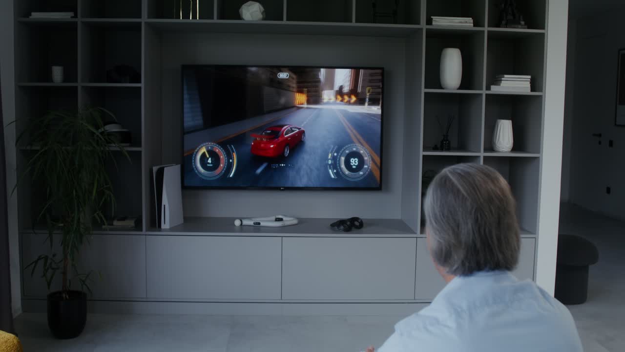 Older man playing video games