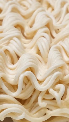 instant pasta rotates in a circle raw macaroni top view instant pasta rotates in a circle raw macaroni top view up close