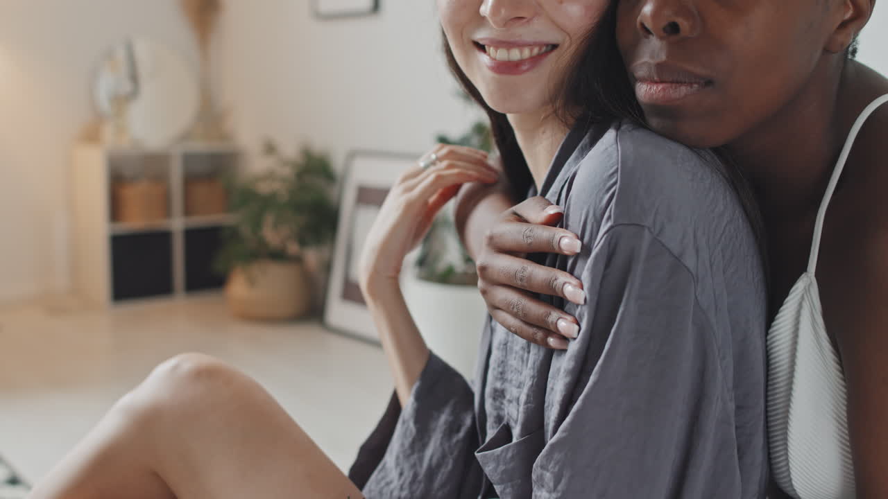 Close Up of Multi-Ethnic Lesbian Couple Hugging