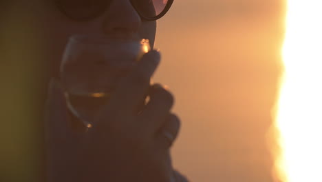 woman drinking water from a glass