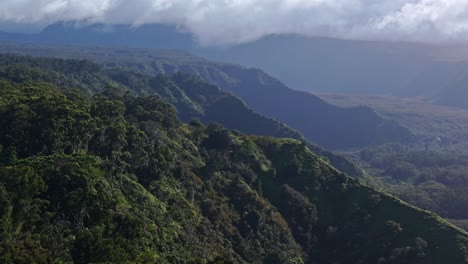 Aerial-view-of-mountains-with-lush-greenery-of-Maui-north-shore-from-road-to-Hana,-Hawaii