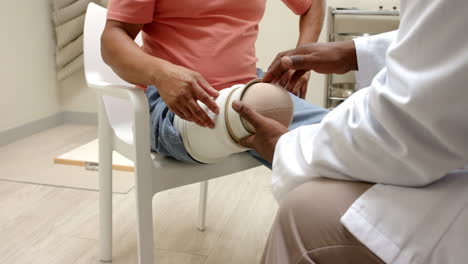 doctor fitting prosthetic leg for patient in medical clinic, providing care