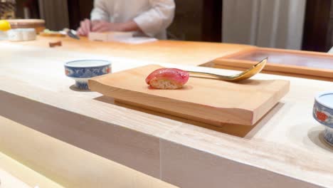 chef crafts sushi with precision and care