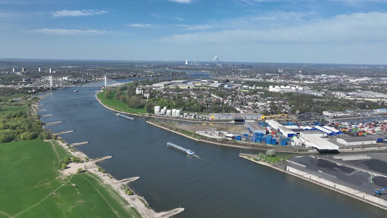 Rhine river, industrial ruhr region, shipping waterway for industrial transport. Infrastructure, Trade and industry in Germany. Aerial view.