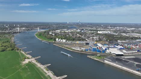 Rhine river, industrial ruhr region, shipping waterway for industrial transport. Infrastructure, Trade and industry in Germany. Aerial view.