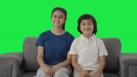 Happy-Indian-sibling-smiling-to-the-camera-Green-screen