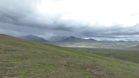 Misty-mountainscape-in-Deosai,-Skardu,-Pakistan---Aerial-flyover