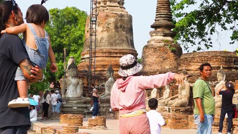 visitors admire historic temple in ayutthaya, thailand