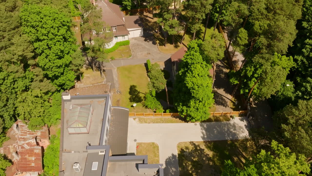Aerial view tilting over seaside homes, revealing the Jūrmala beach, in Latvia