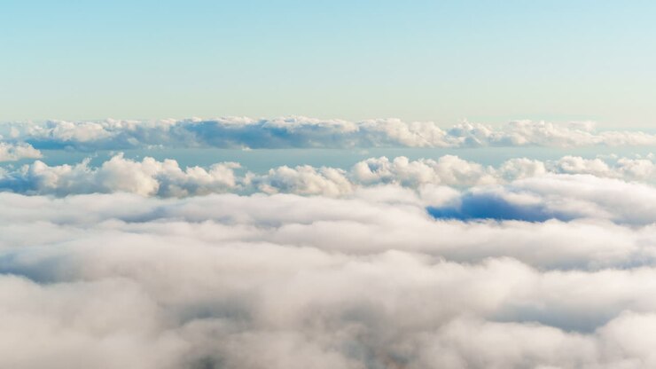 Timelapse of fast moving clouds drifting above distant mountain ranges