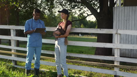 veterinarian using tablet device while talks with girl